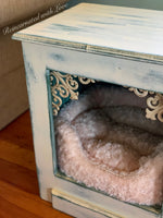 Close up of the distressed, wrought iron accents added to the front of the end table, at the top of the cubby.