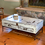 Reclaimed wood, coffee table, done in a distressed white finish with wrought iron base & hardware.