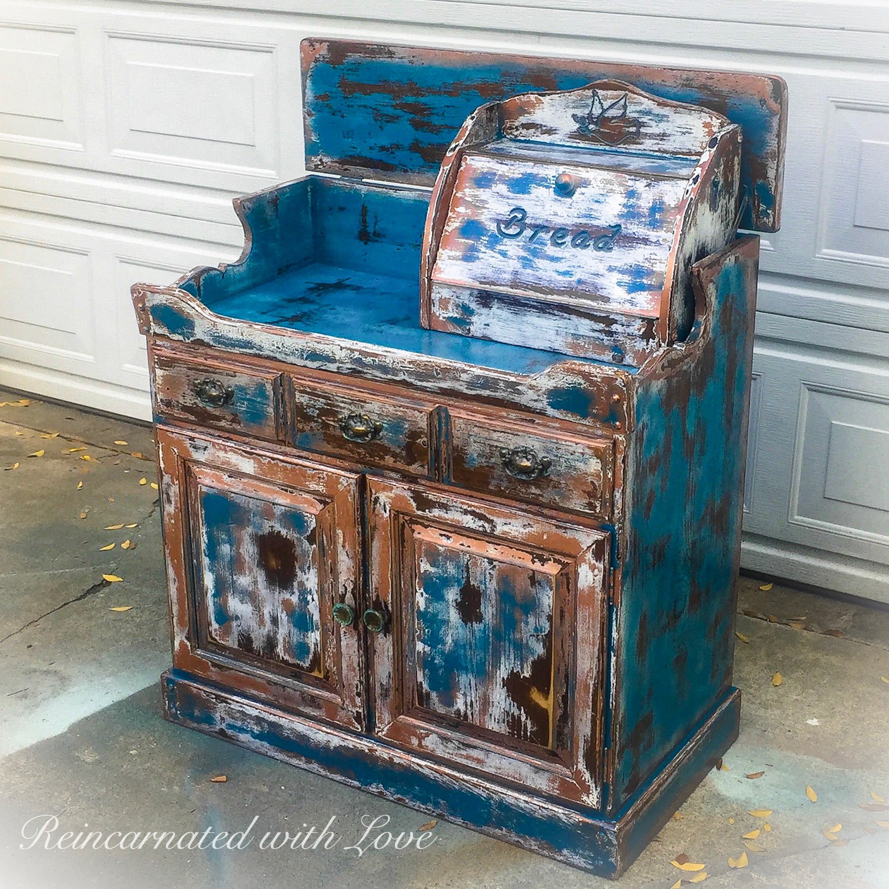 A rustic, farmhouse style, coffee bar, painted & heavily distressed in blue, with white & copper undertones, over solid wood.