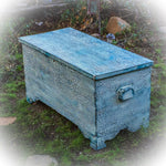 A large, storage chest painted in a shabby chic style, blue & white finish.