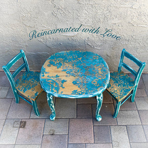 Kid’s table & matching chairs, in distressed blue, with shabby chic, lace accents over stained wood.