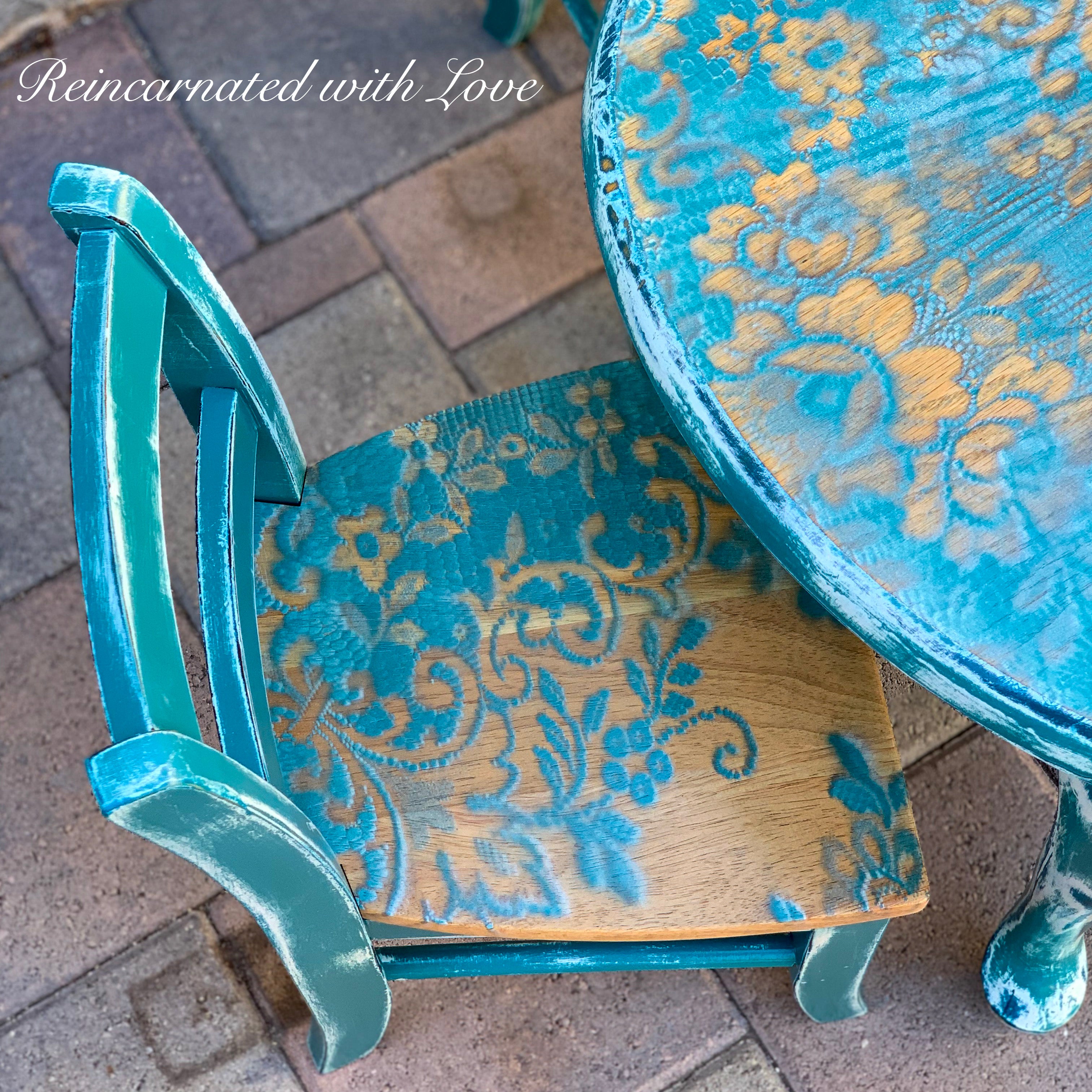 Shabby chic style kid’s table & chair, painted with distressed blue lace accents over stained wood.