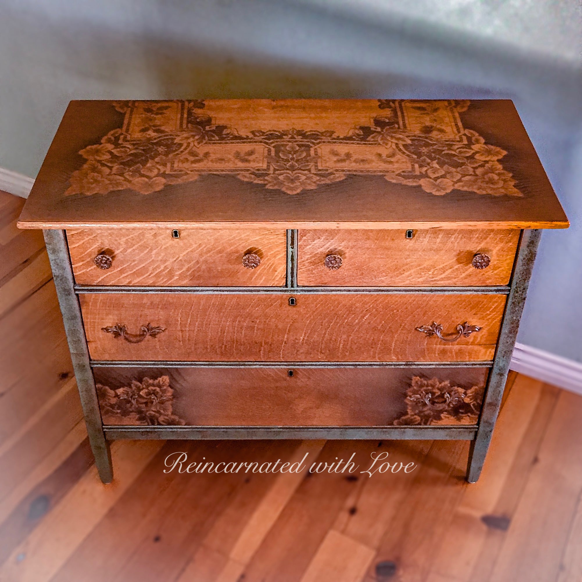 A farmhouse style, chest of drawers, with locking drawers, painted with green trim, stained wood & lace accents.
