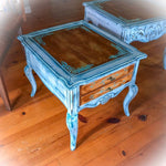 A French country style, end table, done in stained wood with white trim, blue hues & damask accents.