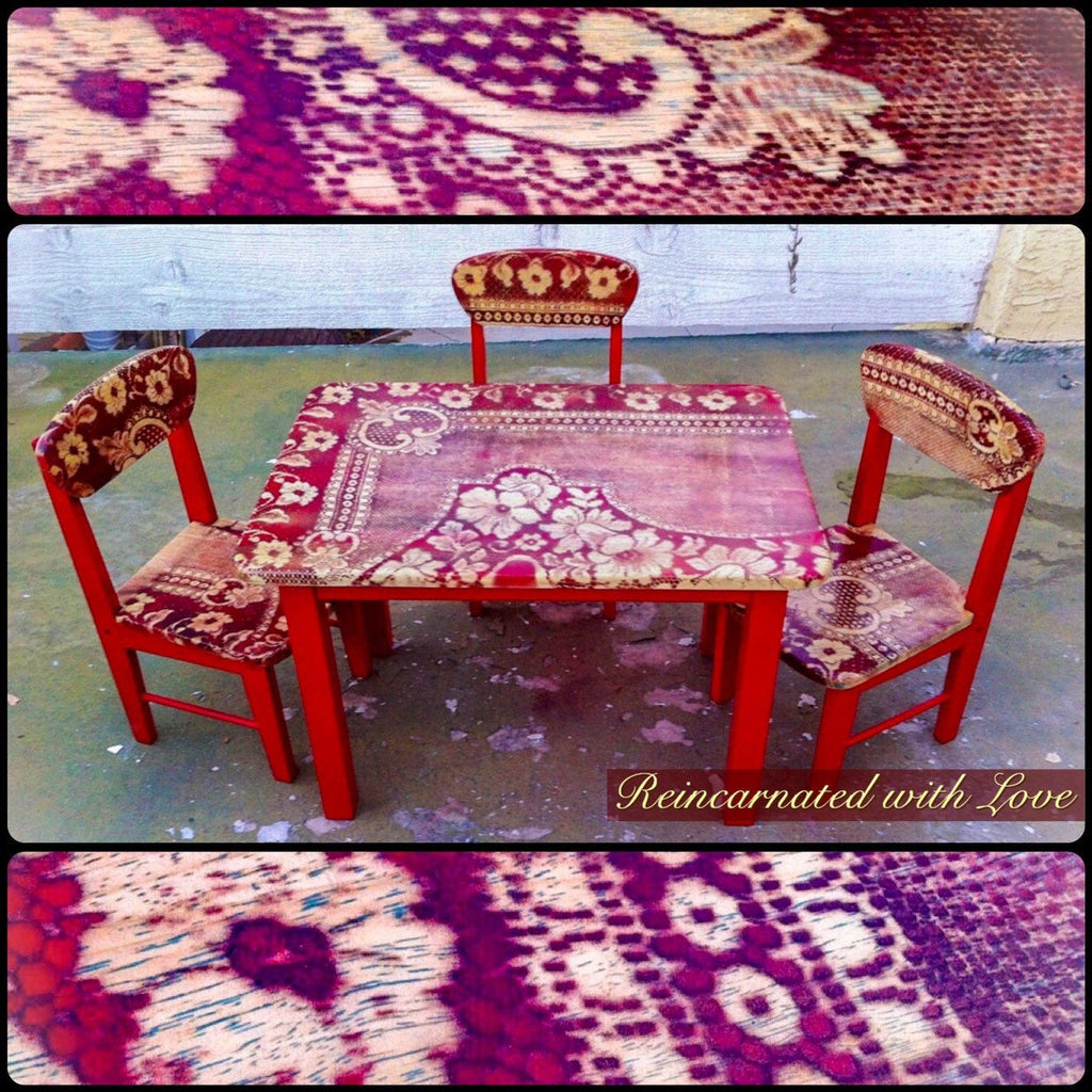 A kid’s table & three chairs, with a red base & distressed, red lace on the stained wood, tabletop & chair seats.