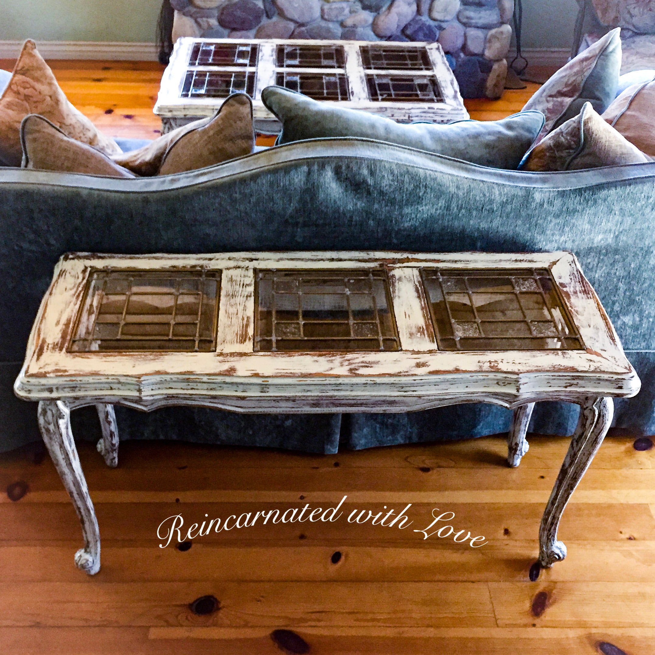 French country sofa table done in distressed white over stained wood