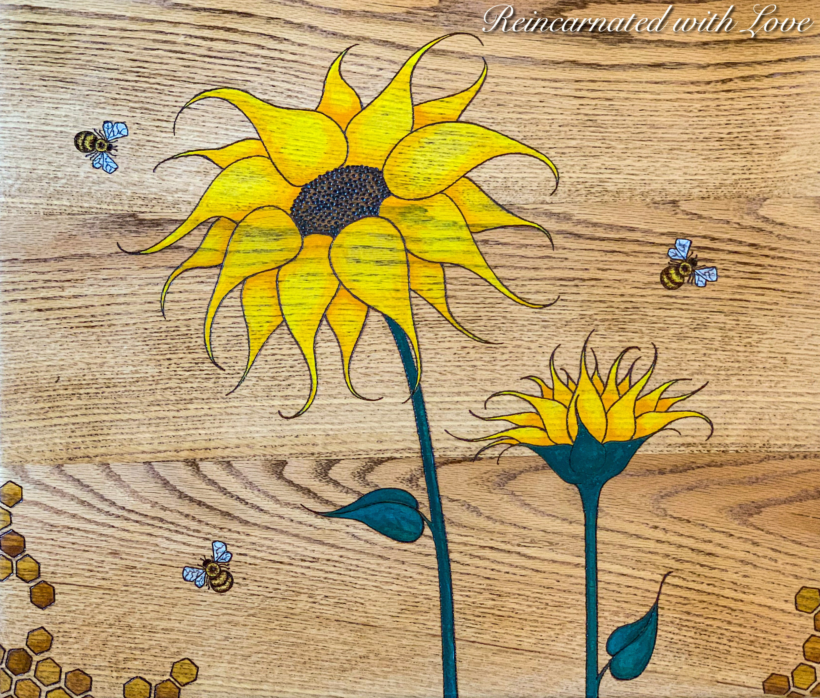 The tabletop on a farmhouse style end table with honeycomb & bee accents in watercolor & burnt wood.