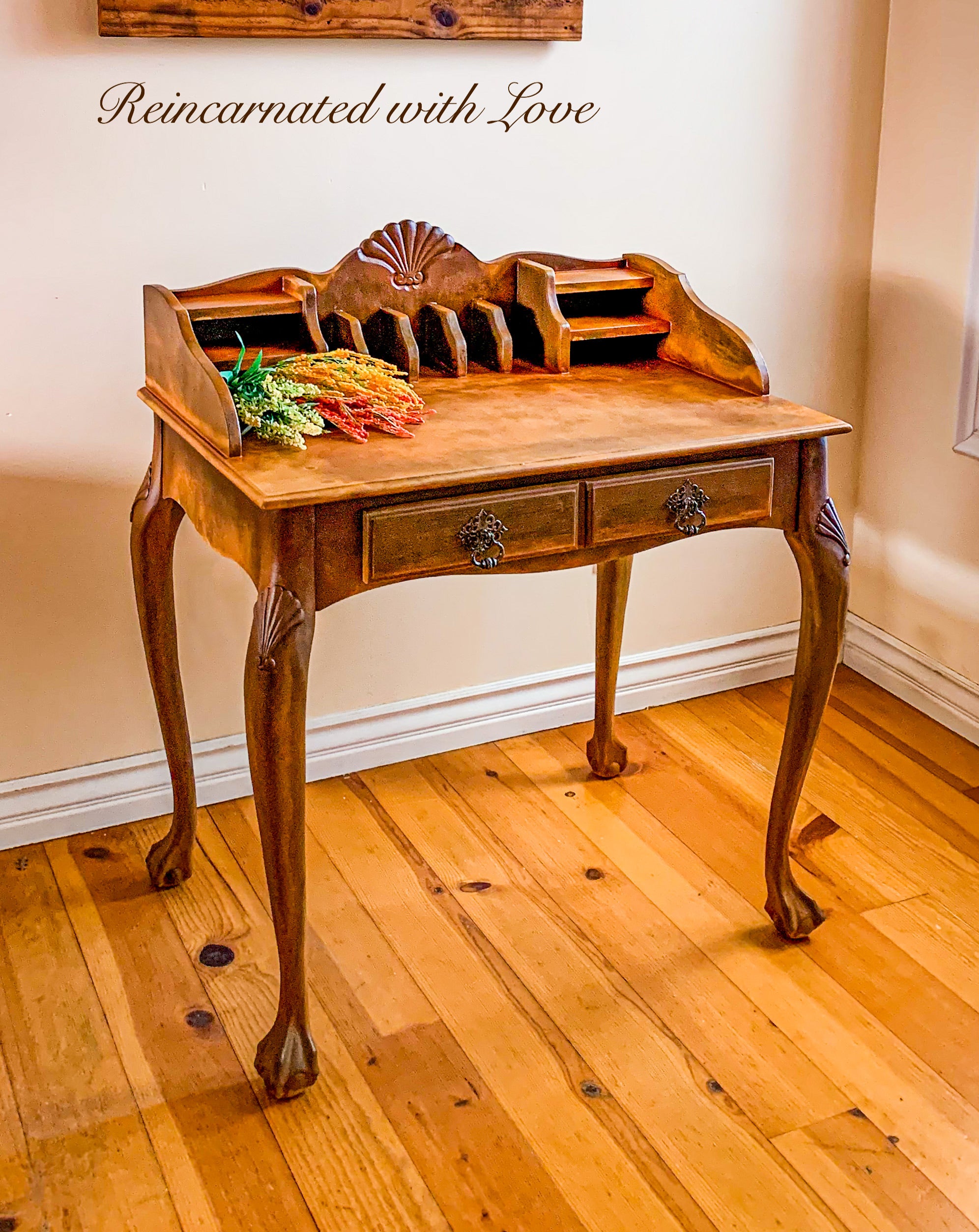 vintage writing desk with curved legs & wood carved accents, refinished in rusted iron over wood.
