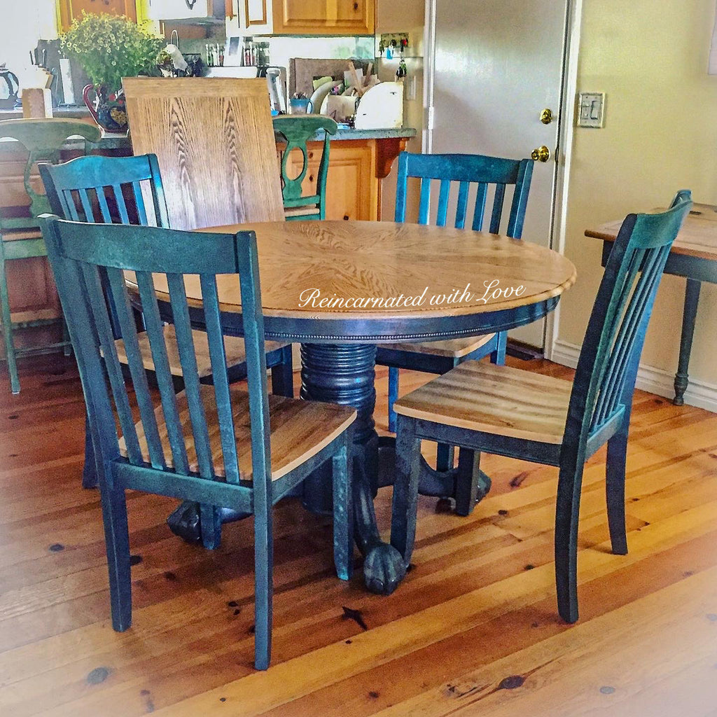 A vintage dining table set, painted in blue patina & stained wood shown with four matching chairs.