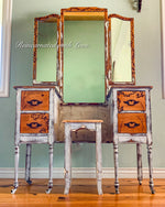 Distressed white & stained wood farmhouse style vanity table with an attached mirror and matching stool.
