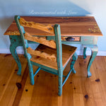 A vintage writing desk & chair set with honeycomb & tiny bee accents burnt into the stained wood portions.