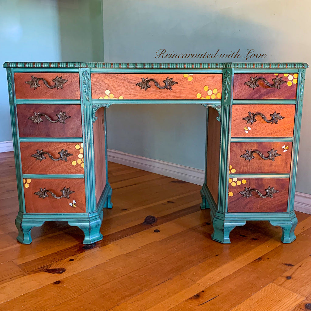 Vintage desk painted in distressed green over stained wood with honeycomb & tiny bee accents.