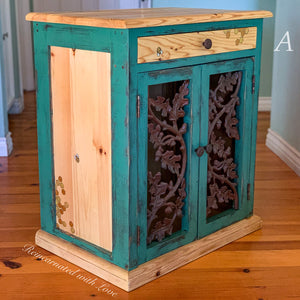 A nightstand painted in distressed green & stained wood with iridescent honeycomb & bee accents.