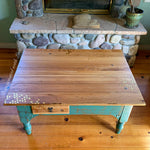 An oak coffee table done in distressed green and stained wood with honeycomb & tiny bee accents.