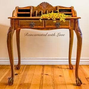 antique style writing desk done in rusted iron hues over solid wood.