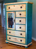 Boho style armoire painted in distressed green over stained wood with honeycomb & bee accents.